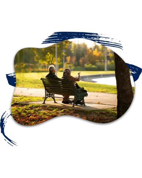 Life Insurance 1 Retired couple sitting on park bench representing life insurance retirement income planning in Orlando Florida